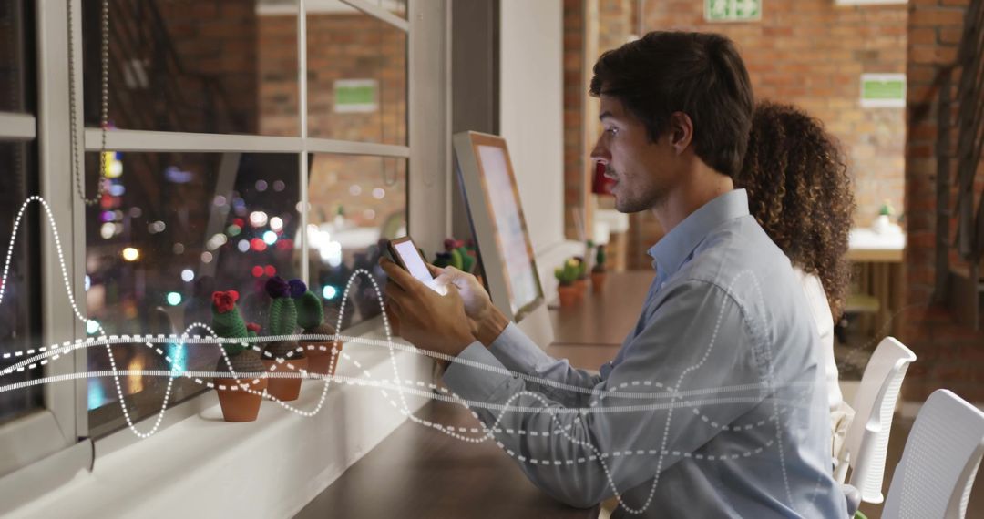 Colleagues Using Smartphones in Modern Office with Digital Interface