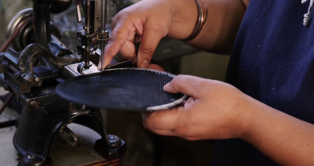 Close-up of Artisan Stitching Leather on Traditional Sewing Machine - Free Images, Stock Photos and Pictures on Pikwizard.com