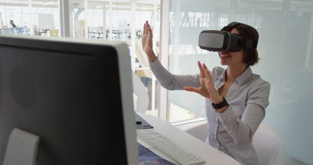 Woman Using Virtual Reality Headset in Office - Free Images, Stock Photos and Pictures on Pikwizard.com