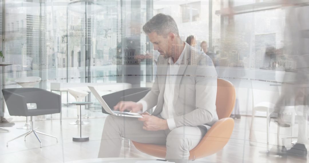 Busy Office with Professional Man Working on Laptop