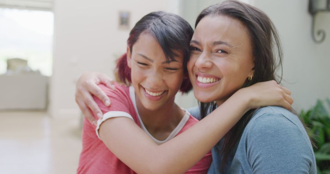 Two Smiling Women Sharing Joyful Moment Together - Free Images, Stock Photos and Pictures on Pikwizard.com