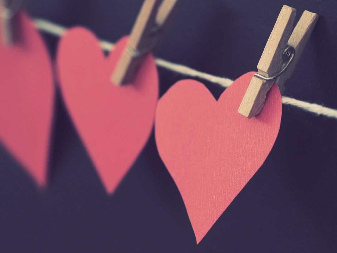 Red Paper Hearts Hung on String Clothespins