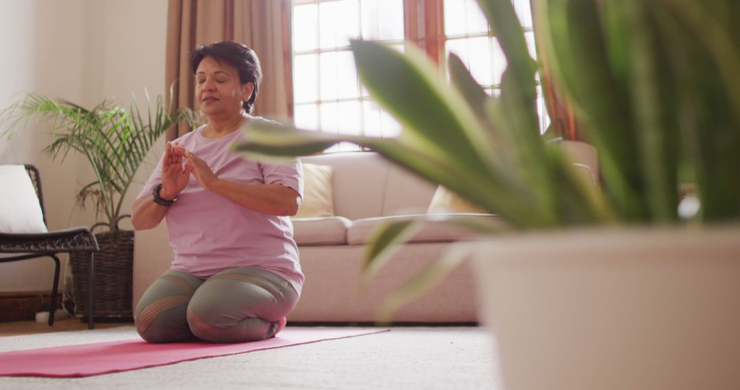 Senior Woman Practicing Mindful Meditation on Yoga Mat at Home - Free Images, Stock Photos and Pictures on Pikwizard.com