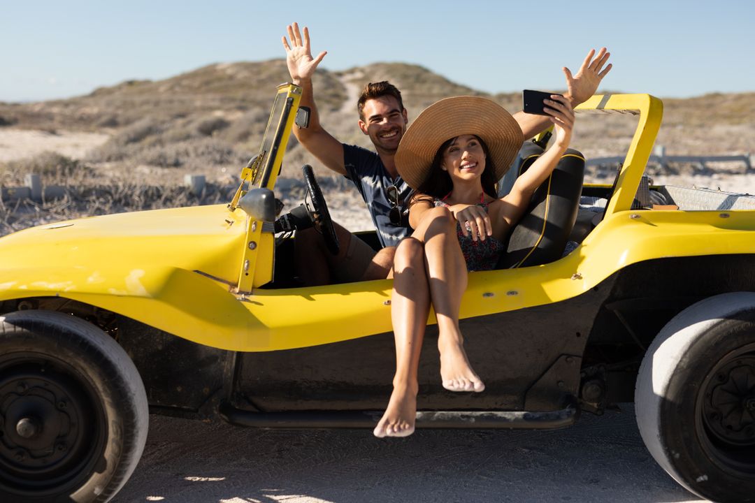 Happy Couple Taking Selfie in Yellow Beach Buggy on Sunny Day - Free Images, Stock Photos and Pictures on Pikwizard.com