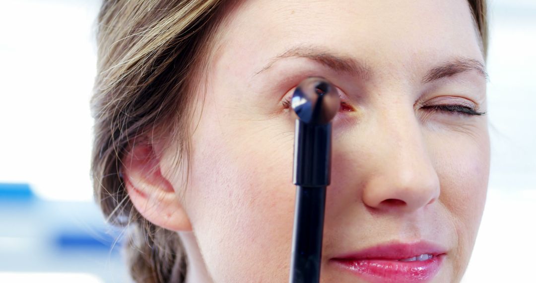 Close-up of a Woman Applying Eye Makeup - Free Images, Stock Photos and Pictures on Pikwizard.com