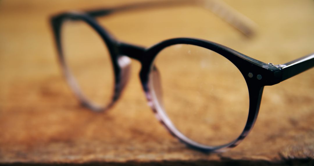 Vintage Round Eyeglasses on Wooden Surface - Free Images, Stock Photos and Pictures on Pikwizard.com