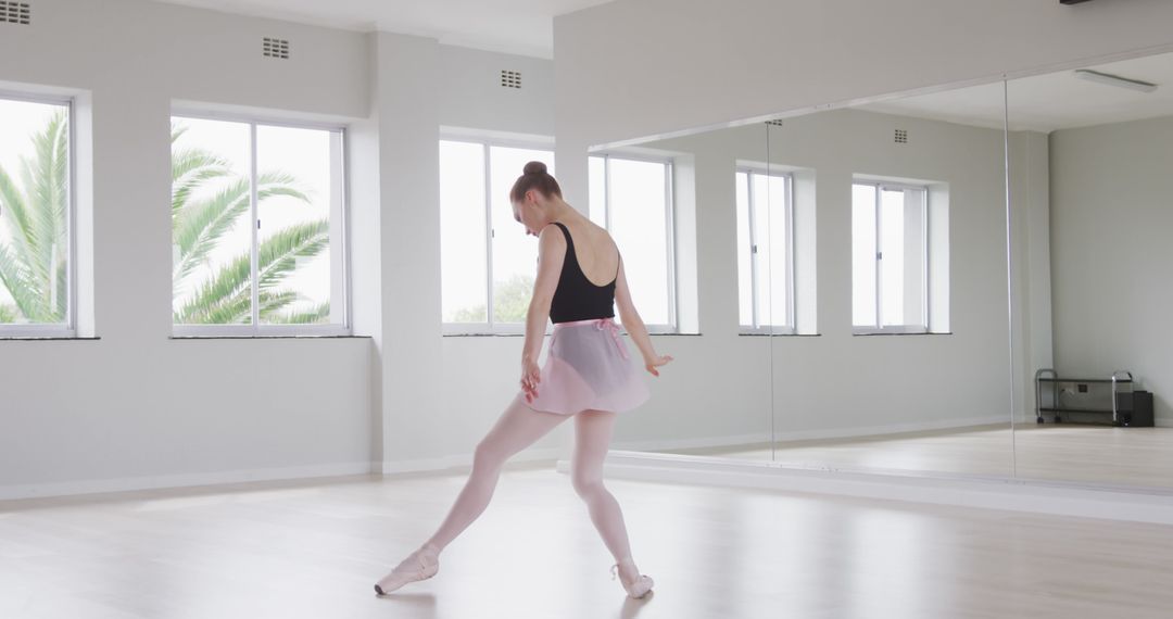 Ballet Dancer Practicing in Bright Studio with Mirrors - Free Images, Stock Photos and Pictures on Pikwizard.com