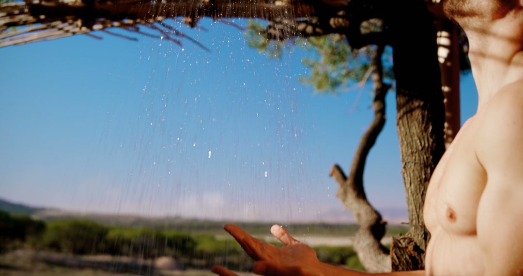 Outdoor Showering in Natural Landscape - Free Images, Stock Photos and Pictures on Pikwizard.com