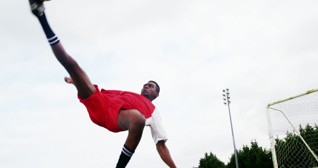 Soccer Player Performing Athletic Bicycle Kick - Free Images, Stock Photos and Pictures on Pikwizard.com