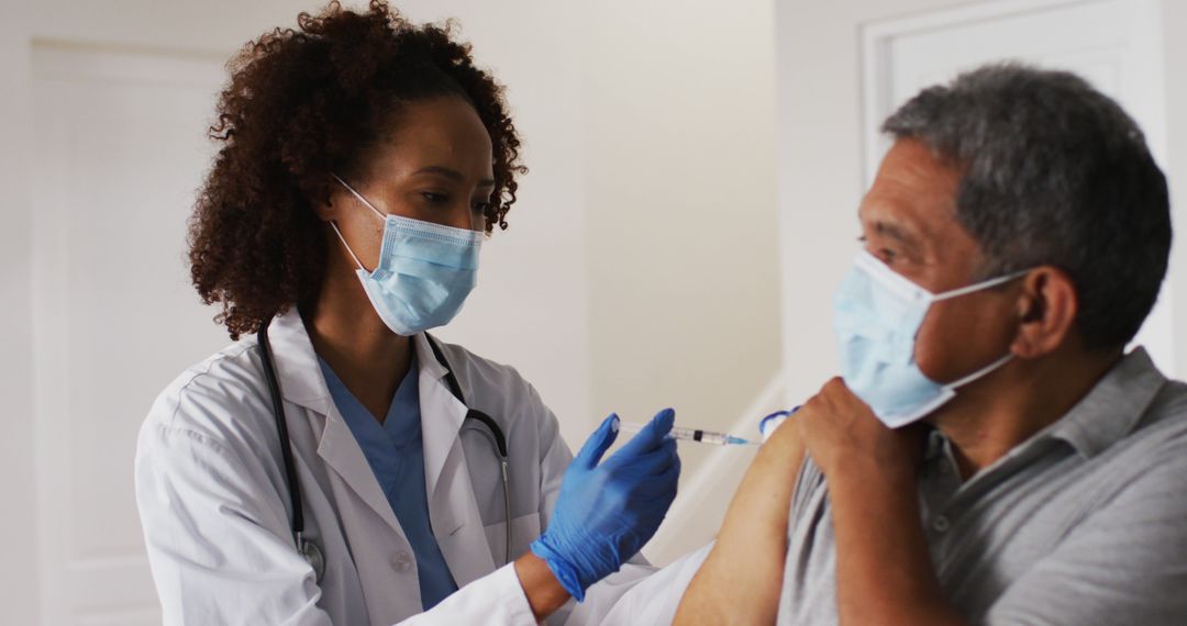 Doctor Administering Vaccine to Senior Man - Free Images, Stock Photos and Pictures on Pikwizard.com