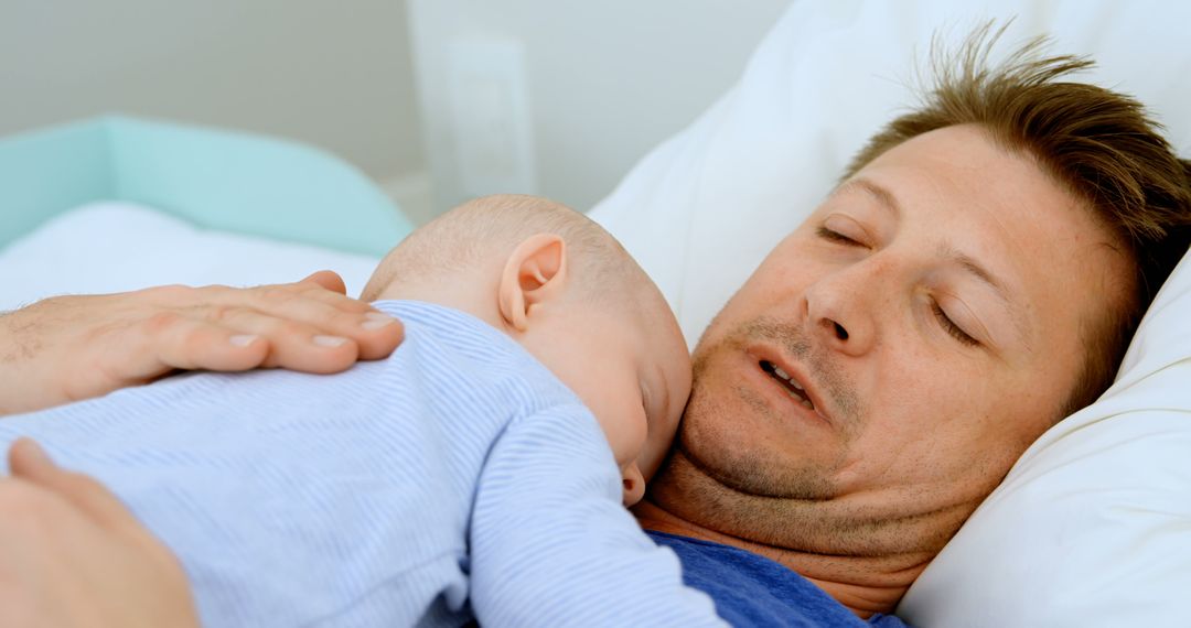 Father Napping with Baby on His Chest in Bed - Free Images, Stock Photos and Pictures on Pikwizard.com