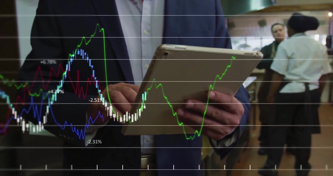Professional Analyzing Financial Data on Digital Tablet