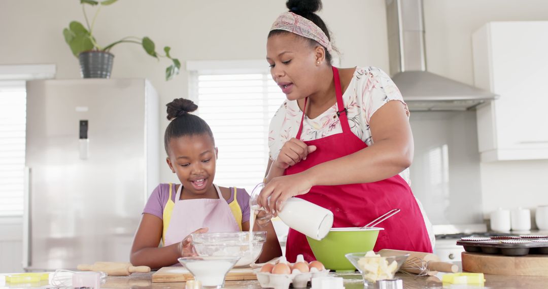 Happy Biracial Mother and Daughter Baking in Kitchen, Bonding Moments Together - Free Images, Stock Photos and Pictures on Pikwizard.com