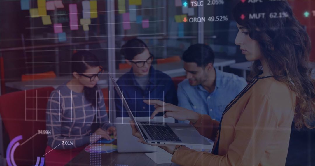 Diverse Team Analyzing Data Visualization on Laptops