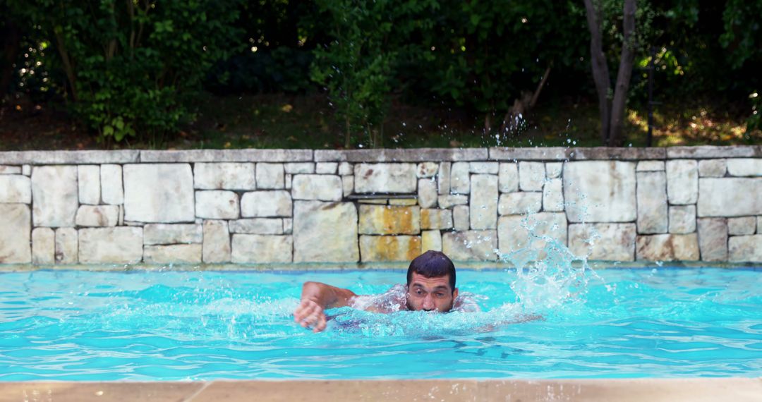 Man Swimming Freestyle in Outdoor Pool - Free Images, Stock Photos and Pictures on Pikwizard.com