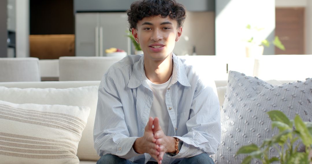 Young Man Relaxing in Modern Living Room with Minimalistic Design
