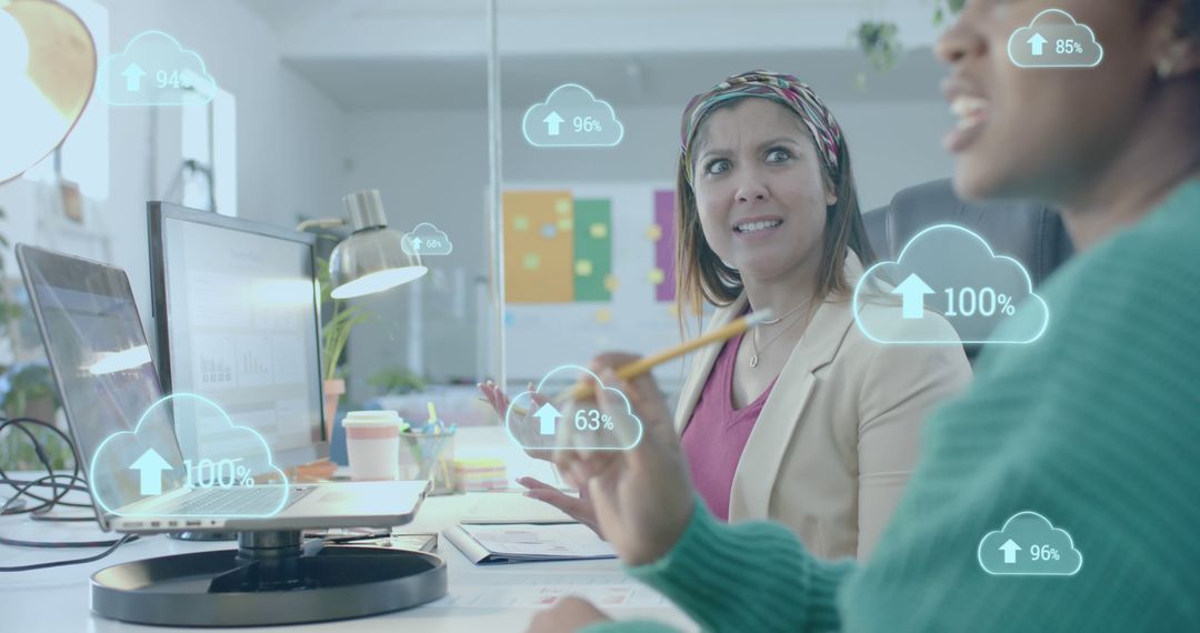 Businesswomen Analyzing Cloud Data in Modern Office - Free Images, Stock Photos and Pictures on Pikwizard.com