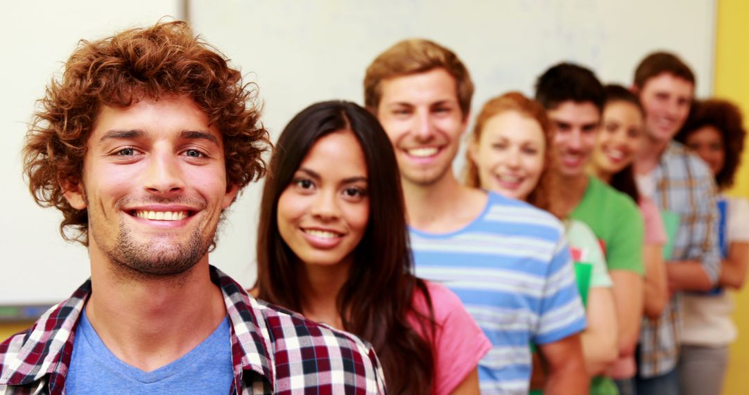 Diverse group of young adults smiling in a row, multicultural friends - Free Images, Stock Photos and Pictures on Pikwizard.com