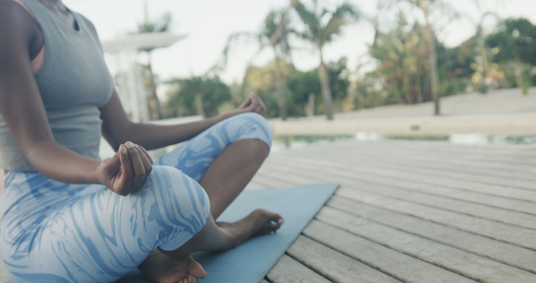 Woman Meditating Outdoors in Yoga Pose by Poolside - Free Images, Stock Photos and Pictures on Pikwizard.com