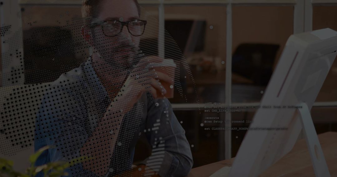 Developer Analyzing Code While Holding Mug in Modern Workspace