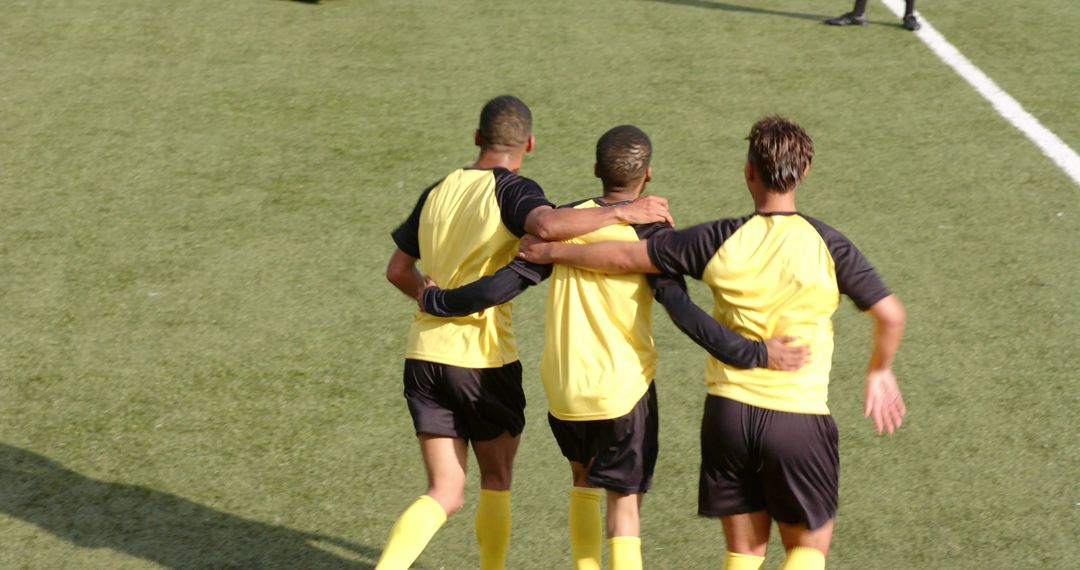 Young Soccer Players Embracing After Practice Game
