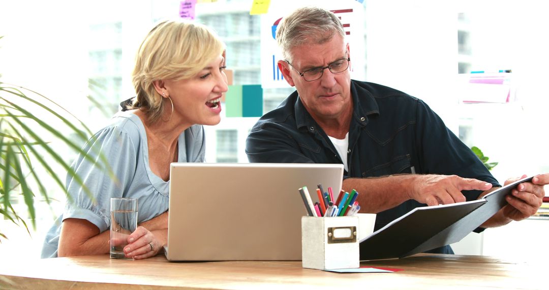 Senior Couple Planning Business Strategy at Office Desk - Free Images, Stock Photos and Pictures on Pikwizard.com