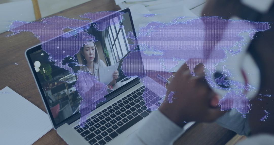 Laptop Showing Remote Work Collaboration with World Map Overlay