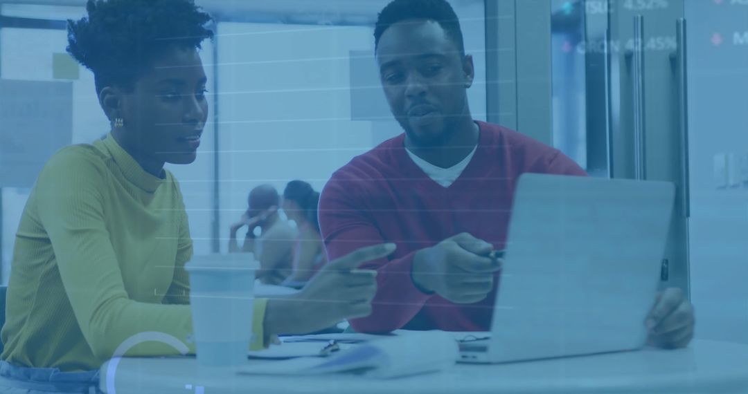 Diverse Colleagues Collaborating on Financial Data Analysis in Office Setting