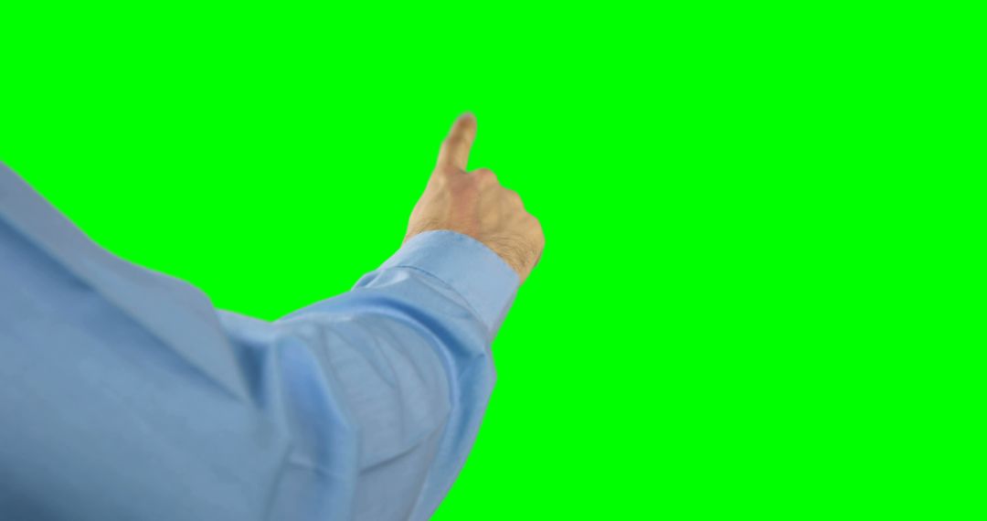 Person Pointing At Green Screen for Visual Effects - Free Images, Stock Photos and Pictures on Pikwizard.com