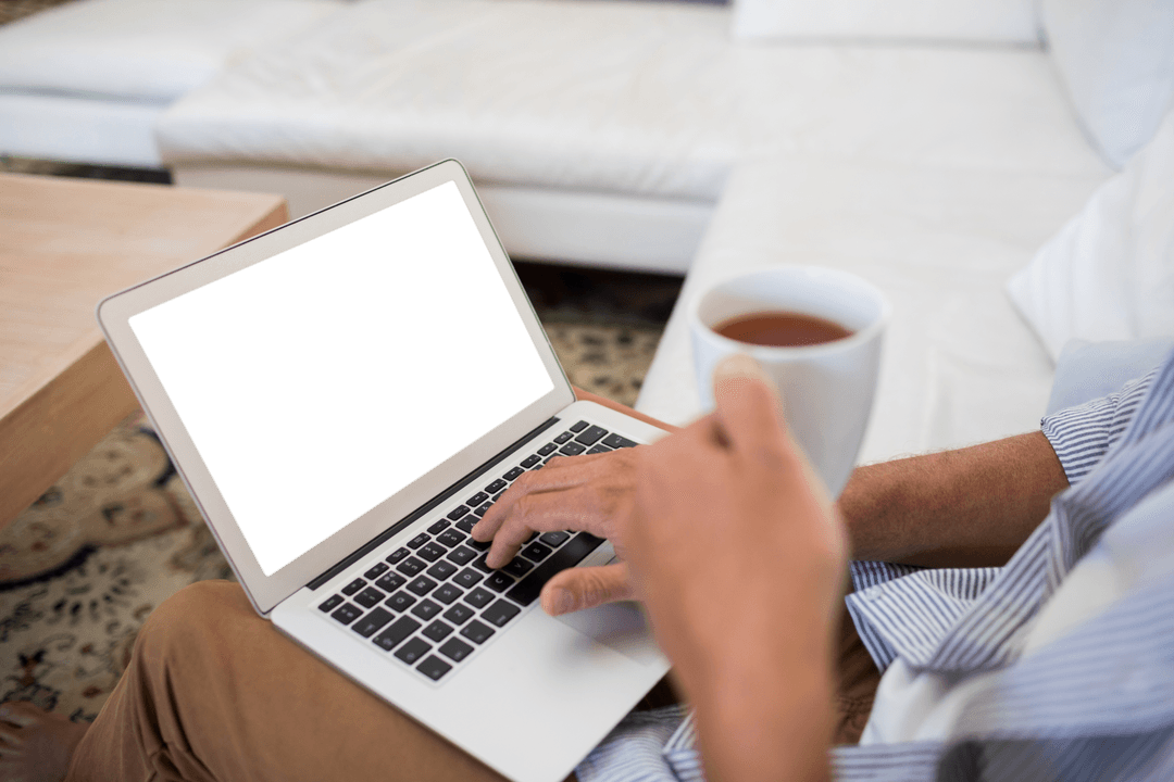 Person Relaxing with Transparent Laptop and Coffee