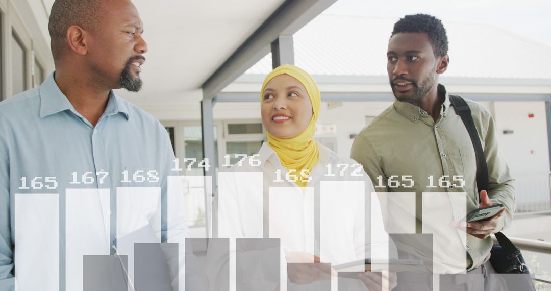 Diverse Business Team Processing Financial Data Graphs