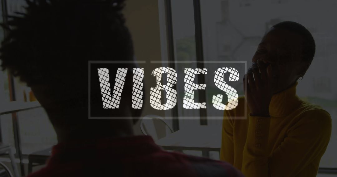 Close Friends Laughing and Enjoying Social Time in Urban Café Setting