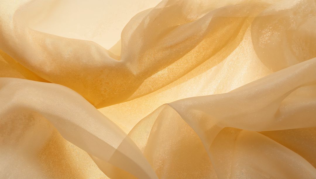 Golden Sheer Fabric Draping with Pearlescent Shimmer and Translucent Layered Folds
