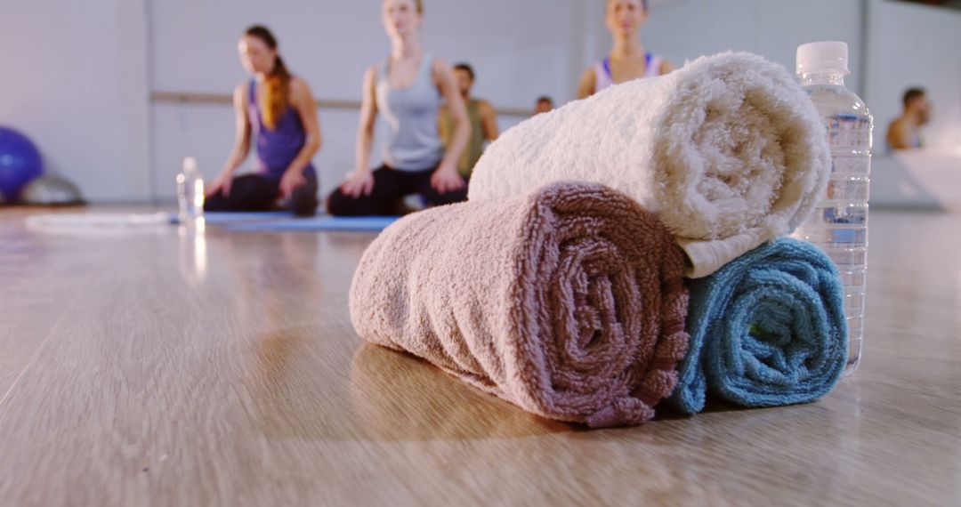 Rolled Towel Stack in Fitness Class with Seated Members - Free Images, Stock Photos and Pictures on Pikwizard.com