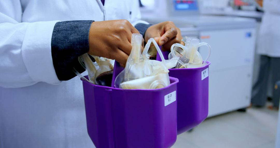 Lab Technician Handling Blood Bags in Medical Laboratory - Free Images, Stock Photos and Pictures on Pikwizard.com