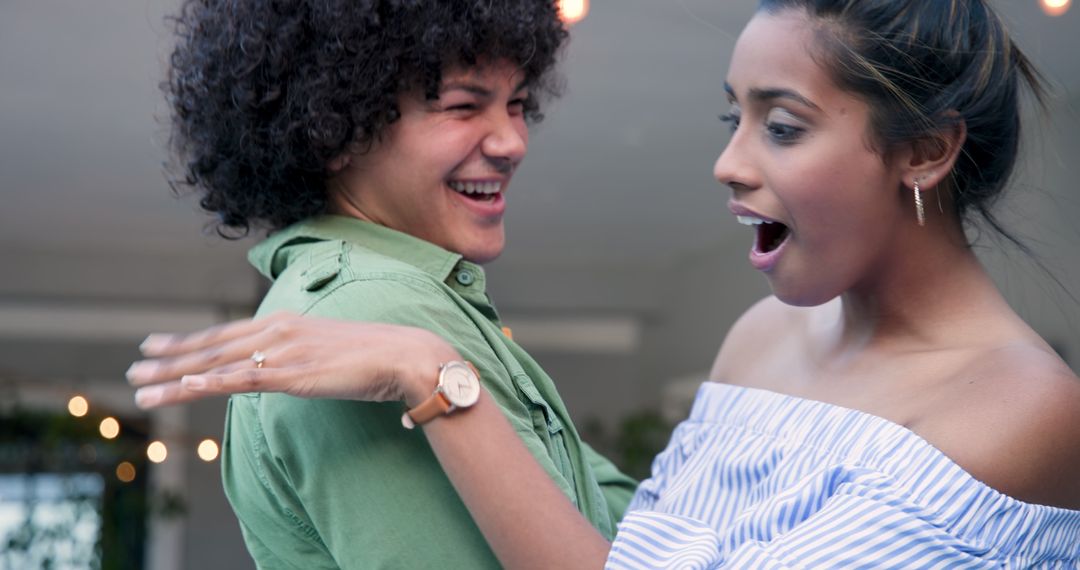 Surprised Woman Sees Engagement Ring in Proposing Partner's Hand