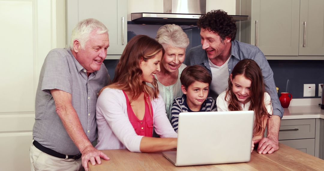 Multigenerational Family Gathering Around Laptop in Kitchen - Free Images, Stock Photos and Pictures on Pikwizard.com