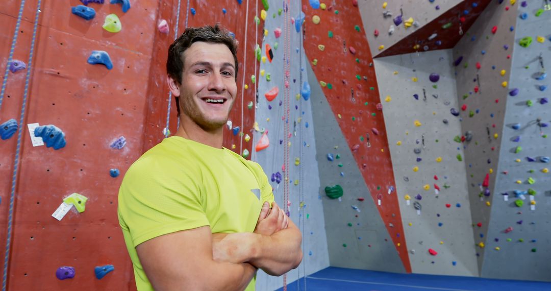 Confident Rock Climber Smiling at Indoor Climbing Gym - Free Images, Stock Photos and Pictures on Pikwizard.com