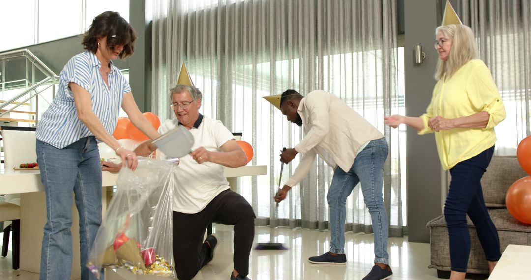 Diverse Colleagues Cleaning Up After Office Party