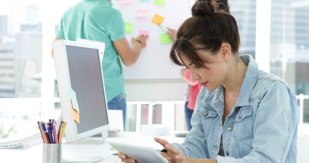 Designer Using Tablet in Creative Office Environment