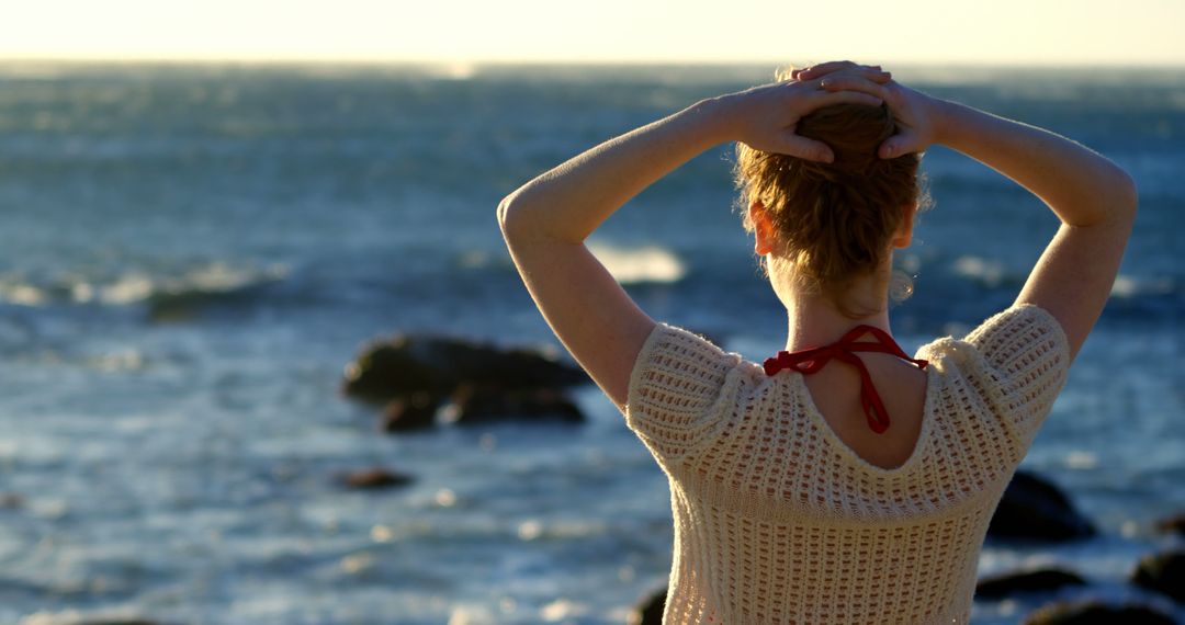 Woman Relaxing on Beach, Facing Ocean at Sunset - Free Images, Stock Photos and Pictures on Pikwizard.com