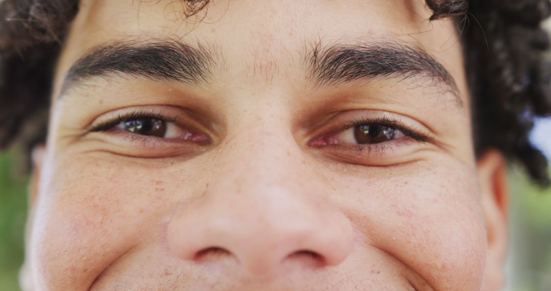 Close-up of Smiling Young Man's Eyes and Face - Free Images, Stock Photos and Pictures on Pikwizard.com