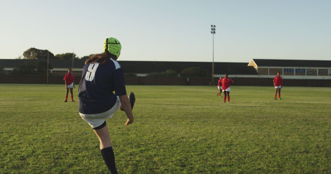 Female Rugby Player Kicking Ball During Practice on Field - Free Images, Stock Photos and Pictures on Pikwizard.com