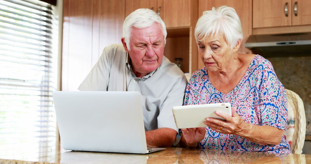 Senior Couple Using Technology Together at Home