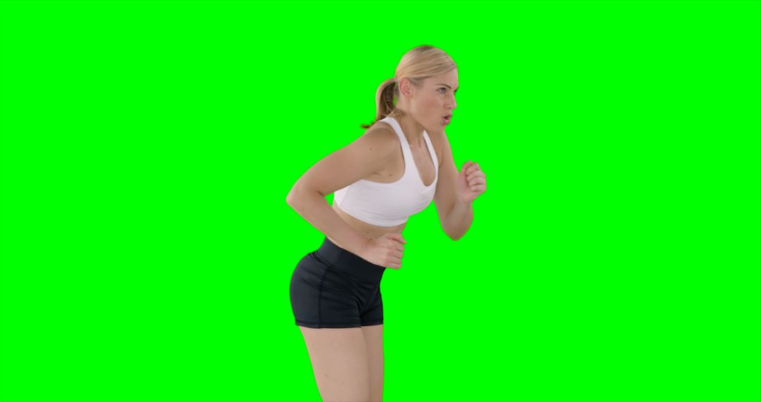 Fit Woman in Athletic Wear Posing Against Green Screen - Free Images, Stock Photos and Pictures on Pikwizard.com