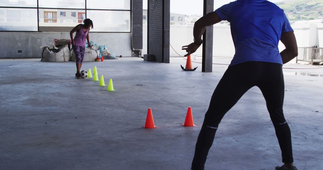 Women Training Football Skills with Cones in Indoor Space - Free Images, Stock Photos and Pictures on Pikwizard.com