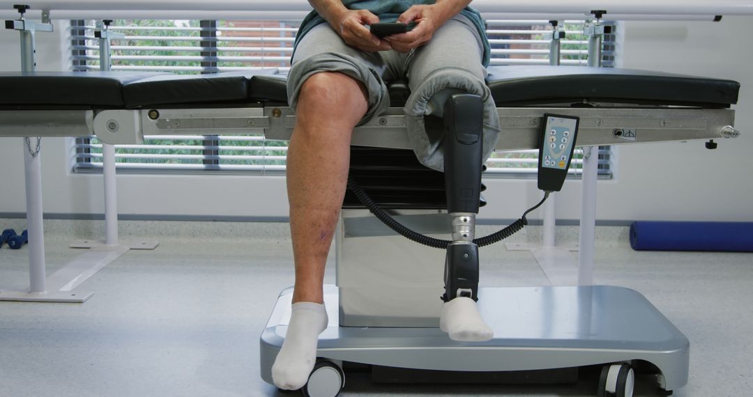 Person Sitting with Prosthetic Leg in Rehabilitation Center - Free Images, Stock Photos and Pictures on Pikwizard.com