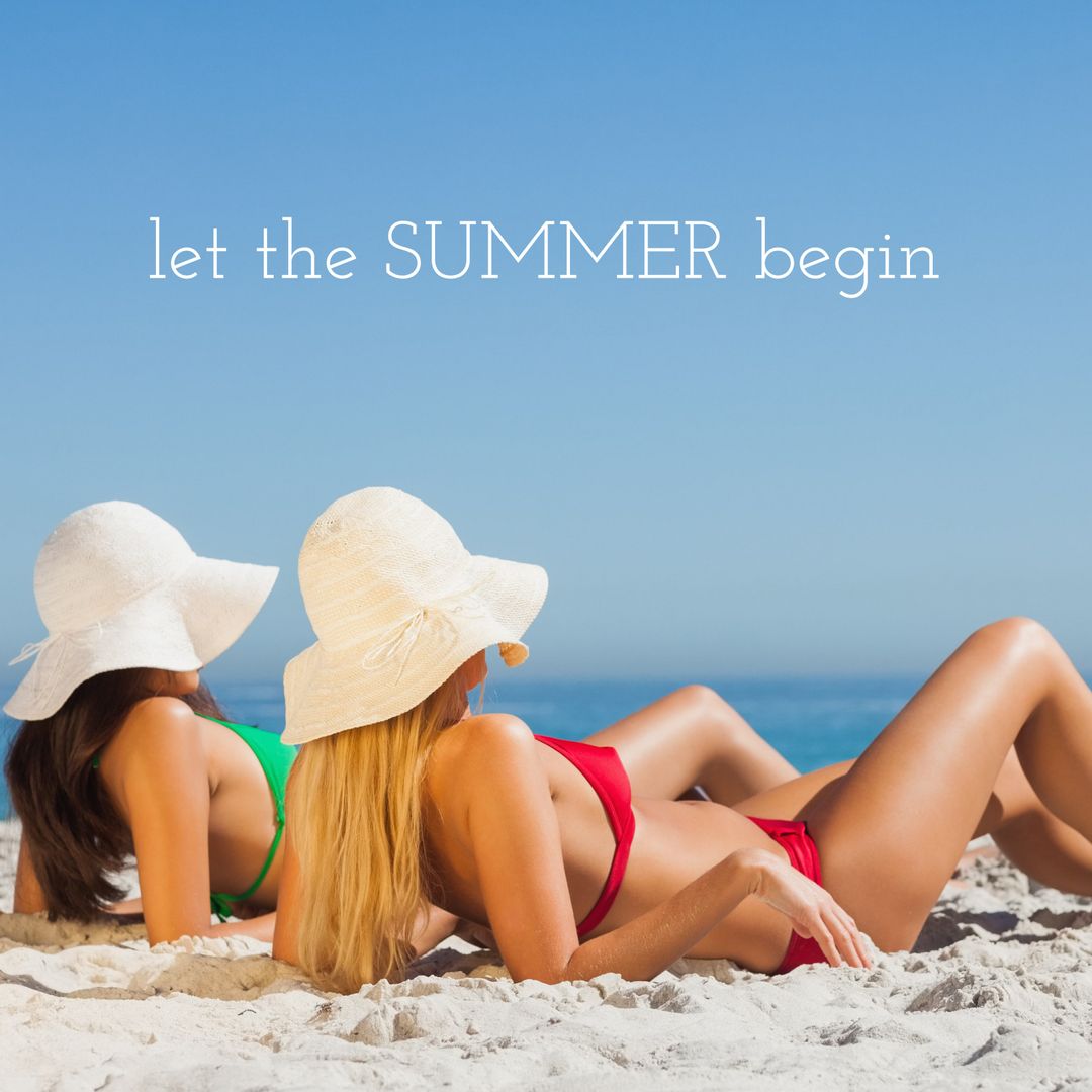 Women Lounging on Sandy Beach Embracing Summer