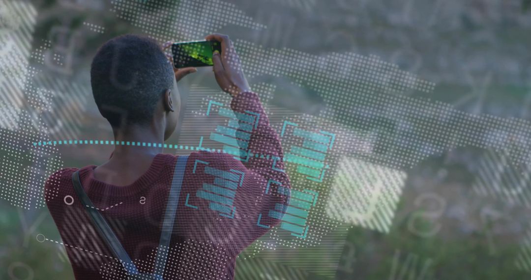 Person Capturing Scenic View Through Smartphone with Technology Overlays