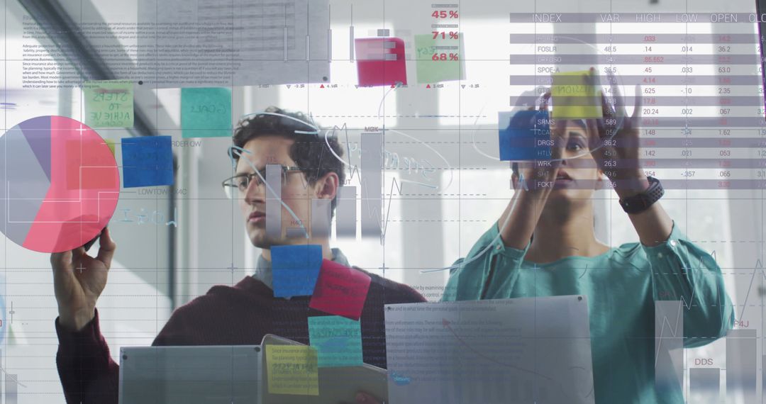 Data Analysts Collaborating on Innovative Strategies in Modern Office